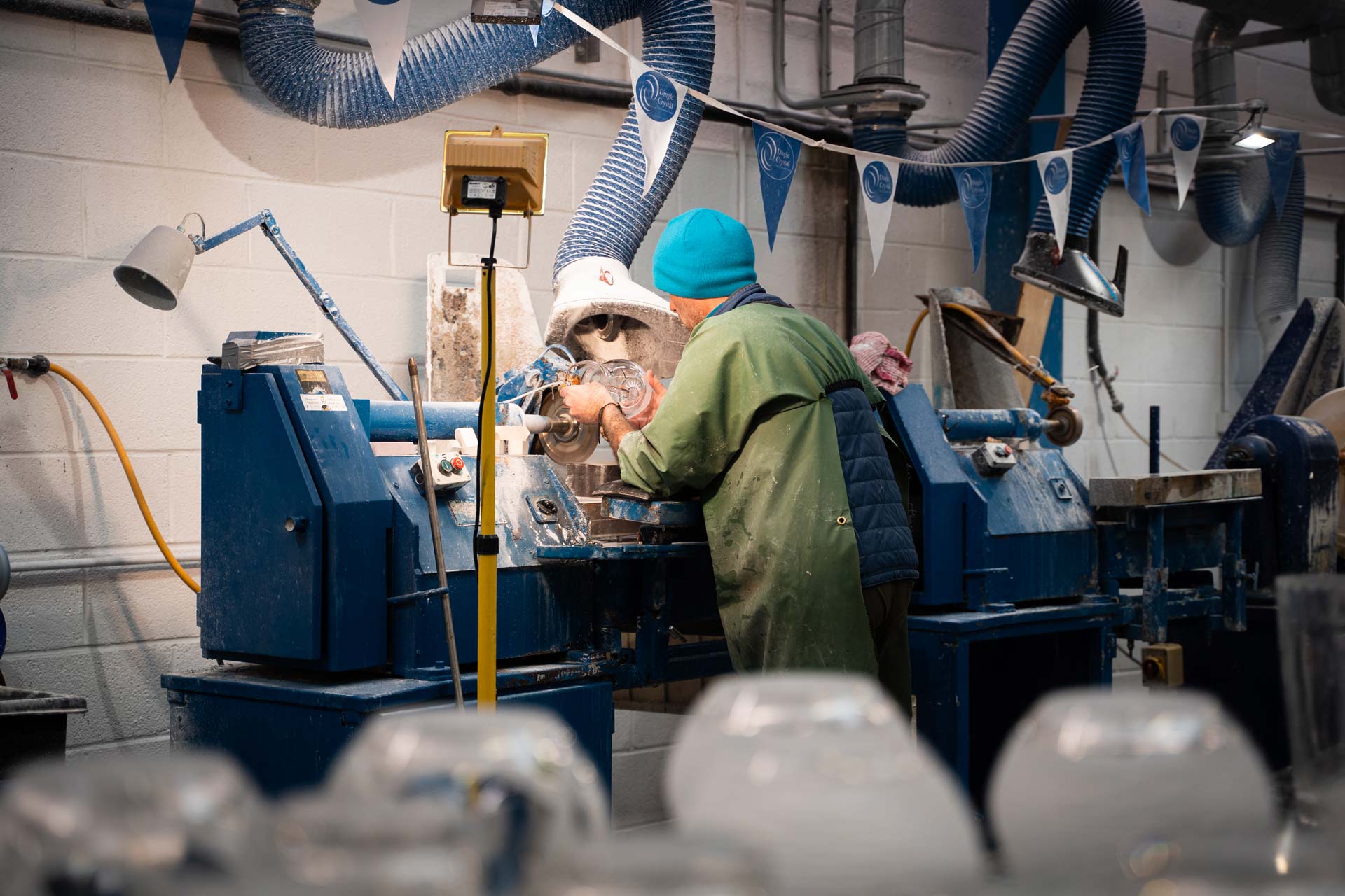 A worker cutting Crystal